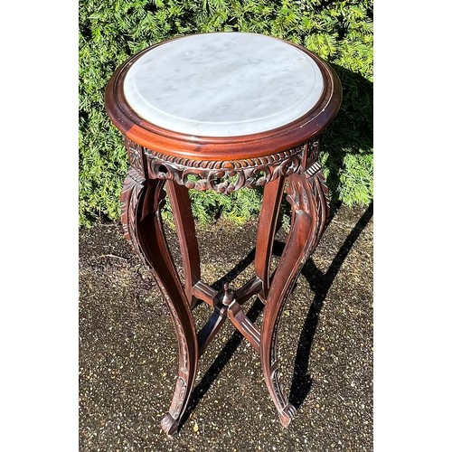 36 - Ornately carved hardwood stand with marble top 92cm h x 40 cm d.