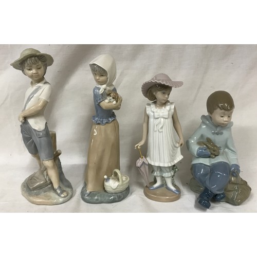 227 - A collection of four Nao figurines to include 