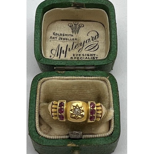 430 - An 18 carat gold ring set with two rows of rubies and a central diamond. In original presentation bo... 