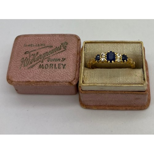 431 - An 18 carat gold ring set with diamonds and sapphires in original presentation box. Weight 2.9gm. Si... 