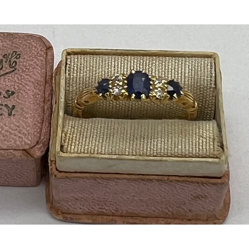 431 - An 18 carat gold ring set with diamonds and sapphires in original presentation box. Weight 2.9gm. Si... 