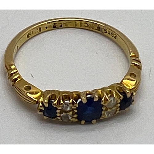 431 - An 18 carat gold ring set with diamonds and sapphires in original presentation box. Weight 2.9gm. Si... 