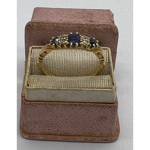 431 - An 18 carat gold ring set with diamonds and sapphires in original presentation box. Weight 2.9gm. Si... 