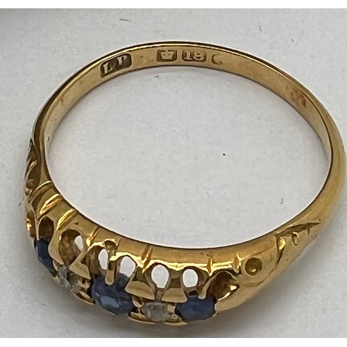 435 - An 18 carat gold ring set with sapphires and diamonds. Weight 3.5gm. Size R/S. In original presentat... 