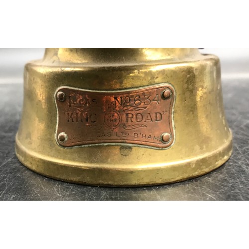 741 - A Lucas `King of the Road` paraffin brass rear lamp, ruby lens, no.634 along with a painted metal po... 