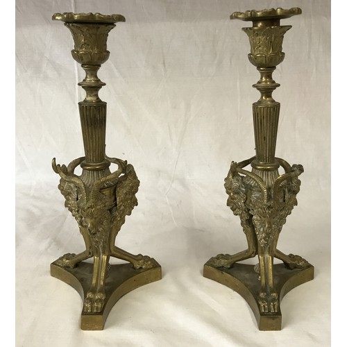 742 - A gilt metal five branch candelabra 58cm h, along with a pair of ornate brass candle sticks decorate... 