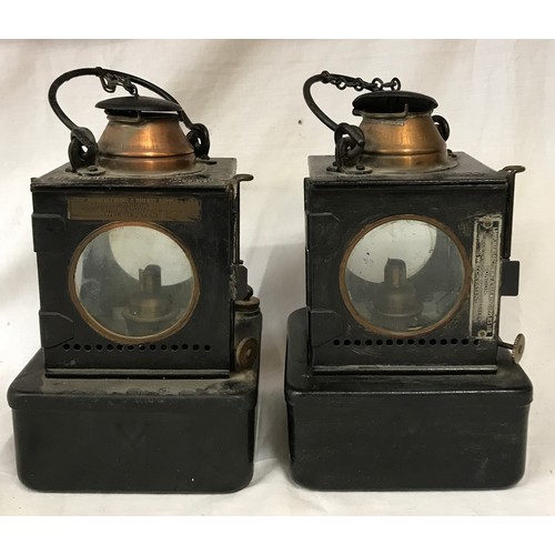 745 - A pair of Midland paraffin lamps with four sided clear glass lens and plaque denoting lamp manufactu... 