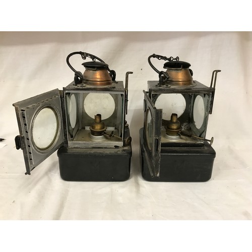 745 - A pair of Midland paraffin lamps with four sided clear glass lens and plaque denoting lamp manufactu... 