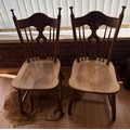 Two oak side chairs.