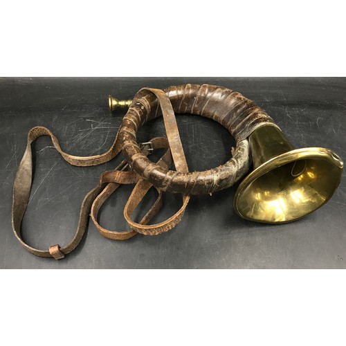 1005 - A collection of brass items to include a pair of matching cherubs, horn wrapped in leather, back scr... 