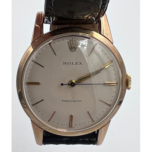A 1960's 9ct gold Rolex Precision gentleman's presentation wristwatch with cream dial on black leather strap. Stamped to inner case 17501. 9 .375. Case: 32mm. In brown wooden Rolex case and green box. Inscribed to back Le Riches Stores. M.H. Fouzel. 1919-1966. Loyal Service.

Winds and goes, in very good condition.