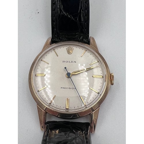 529 - A 1960's 9ct gold Rolex Precision gentleman's presentation wristwatch with cream dial on black leath... 