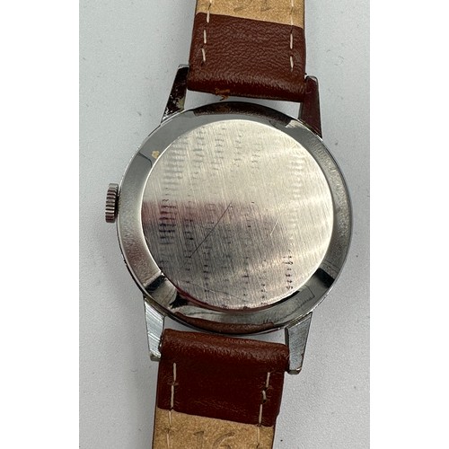 539 - A Tudor vintage wristwatch on brown leather strap on Rolex stainless steel case. 32mm case.

Winds a... 