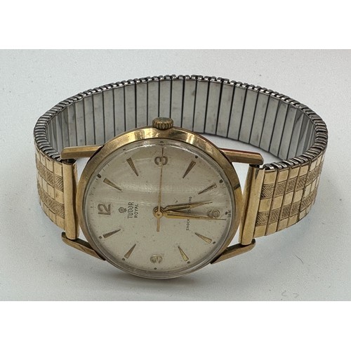 543 - A 1960's 9ct gold presentation Tudor wristwatch on gold plated expanding bracelet, Rolex case marked... 