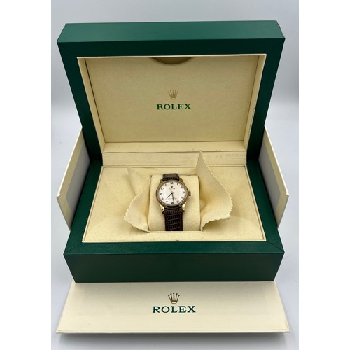 546 - A boxed 9ct gold gentleman's precision Rolex wristwatch on brown leather strap with blue and gold ha... 