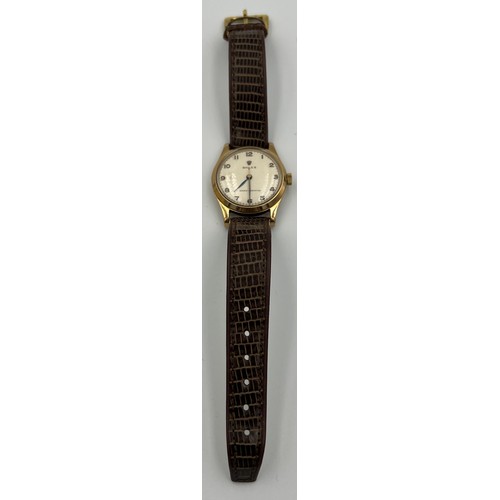 546 - A boxed 9ct gold gentleman's precision Rolex wristwatch on brown leather strap with blue and gold ha... 