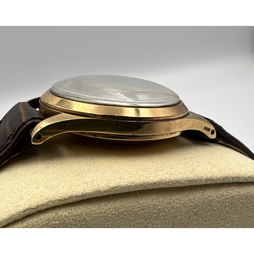 546 - A boxed 9ct gold gentleman's precision Rolex wristwatch on brown leather strap with blue and gold ha... 