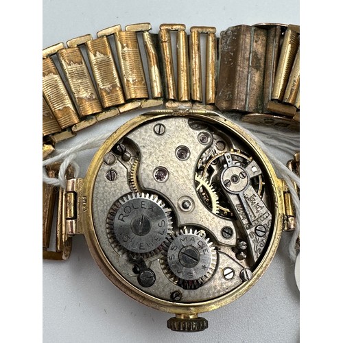 553 - A 1919 manual wind 15 jewel Rebberg movement Rolex Military trench watch, 9ct gold case on rolled go... 