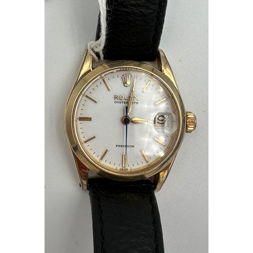 560 - A Rolex Precision Oysterdate midi size wristwatch on black leather strap and gold plated case. Case ... 