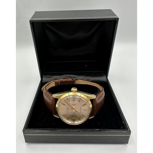 562 - A Rolex Oyster Perpetual Date wristwatch on gold plated case and brown leather strap. Case 34mm. Wit... 