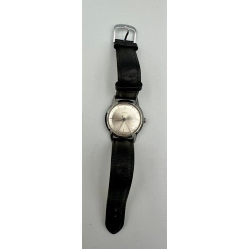 564 - An Elgin stainless steel waterproof wristwatch on black leather strap in black Elgin case. Case: 31m... 