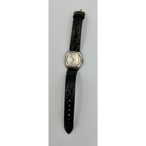 565 - A ladies stainless steel Rolex wristwatch on black leather strap and square case. In green Rolex box... 