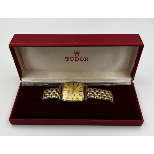 576 - A 1950's 9ct gold cased Rolex Tudor hand winding dress watch with gold plated bracelet. Rolex crown.... 