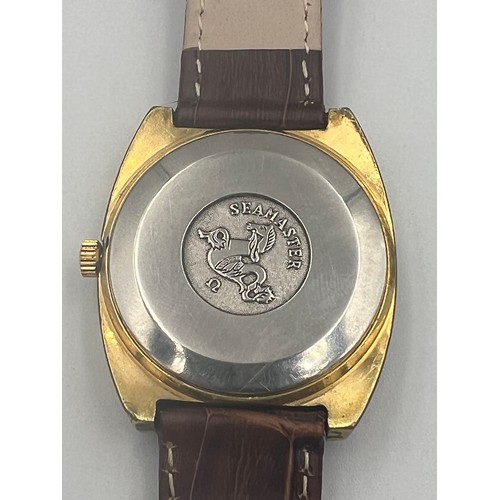 583 - A Vintage gold plated Omega Seamaster automatic wristwatch with date aperture on brown leather strap... 