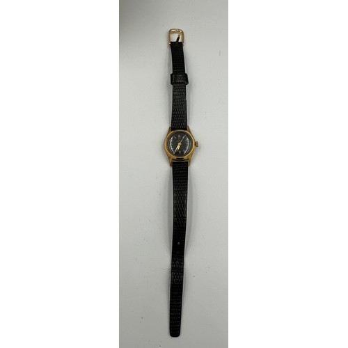 590 - A Tudor ladies wristwatch on black leather strap. Inner case stamped 403028. Outer stamped 1299. Cas... 