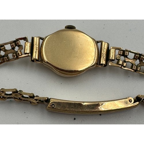 591 - A 9ct gold ladies Tudor wristwatch on rolled gold chain. Inner stamped 334025. B&S case made for Rol... 