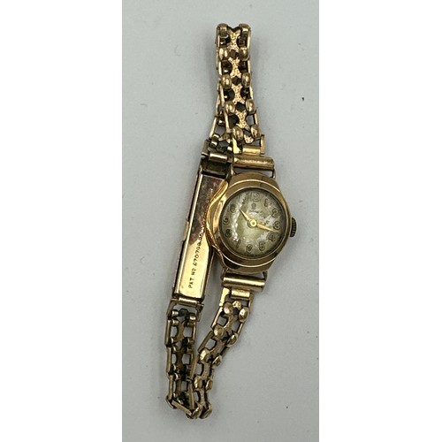 591 - A 9ct gold ladies Tudor wristwatch on rolled gold chain. Inner stamped 334025. B&S case made for Rol... 