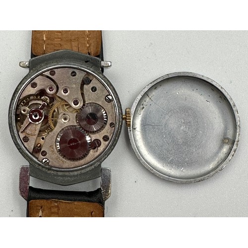 592 - An unsigned 1930's vintage hand winding gentleman's wristwatch with leather strap. Omega case. White... 