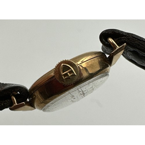 602 - A 9ct gold ladies Tudor Royal wristwatch on black leather strap. Case with full hallmarks. Inner sta... 