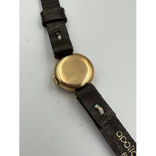 602 - A 9ct gold ladies Tudor Royal wristwatch on black leather strap. Case with full hallmarks. Inner sta... 