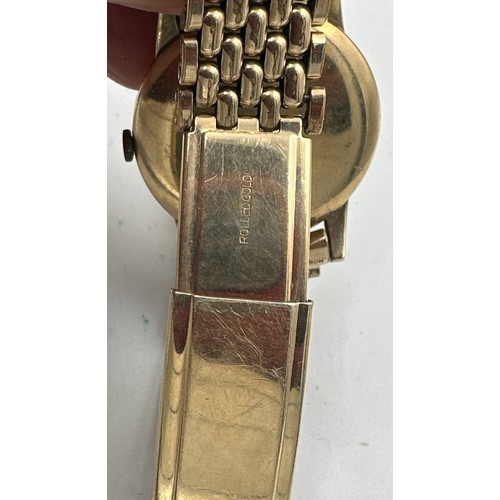 603 - A 9ct gold gentleman's Tudor Shock-Resisting wristwatch on rolled gold bracelet. Rolex case. Inside ... 