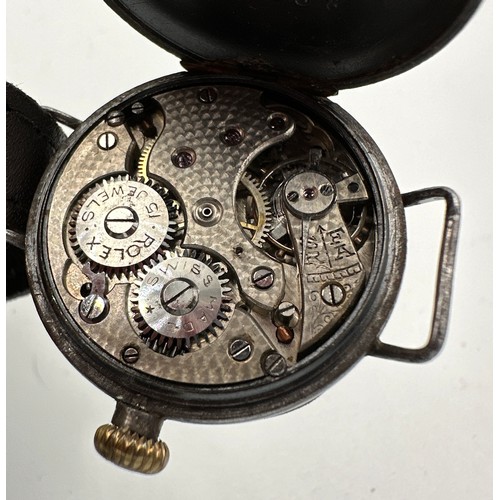 605 - A 1920's Rolex trench watch. Case: 29mm. Inner case stamped 64355R.

Winds and goes. Ceramic dials w... 