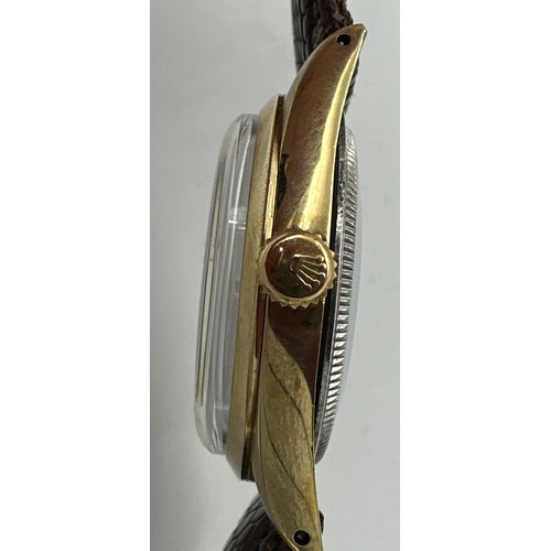 607 - A gentleman's Rolex Oyster Perpetual wristwatch, gold plated case on lizard skin strap. 33mm case. R... 