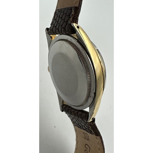 607 - A gentleman's Rolex Oyster Perpetual wristwatch, gold plated case on lizard skin strap. 33mm case. R... 