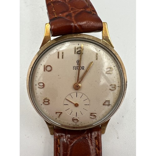 608 - A gentleman's 9ct gold presentation Tudor wristwatch on brown leather strap. Full hallmarks to inner... 