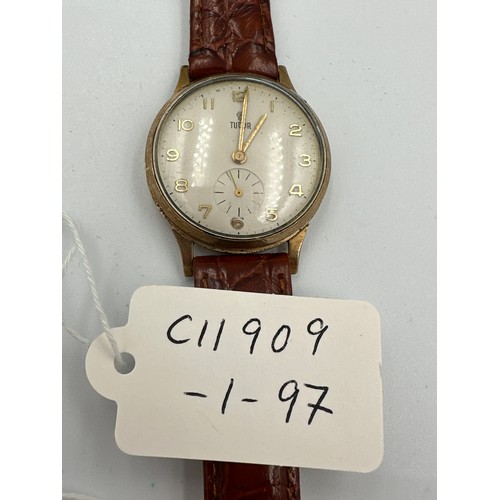 608 - A gentleman's 9ct gold presentation Tudor wristwatch on brown leather strap. Full hallmarks to inner... 