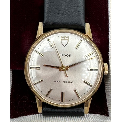 617 - A 9ct gold Rolex Tudor presentation watch on black leather Rolex strap. Presented to J.M. Platje by ... 