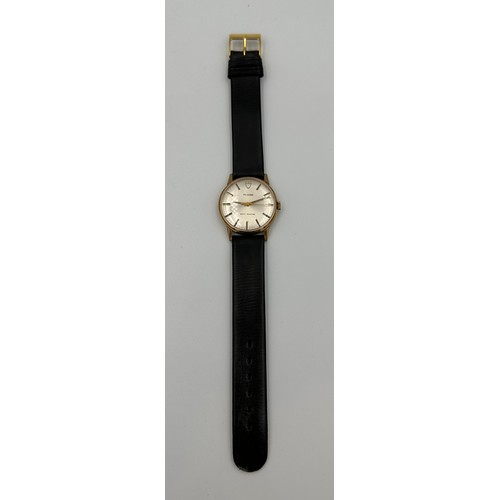 617 - A 9ct gold Rolex Tudor presentation watch on black leather Rolex strap. Presented to J.M. Platje by ... 