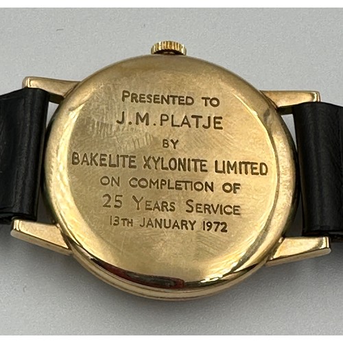 617 - A 9ct gold Rolex Tudor presentation watch on black leather Rolex strap. Presented to J.M. Platje by ... 