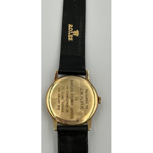 617 - A 9ct gold Rolex Tudor presentation watch on black leather Rolex strap. Presented to J.M. Platje by ... 