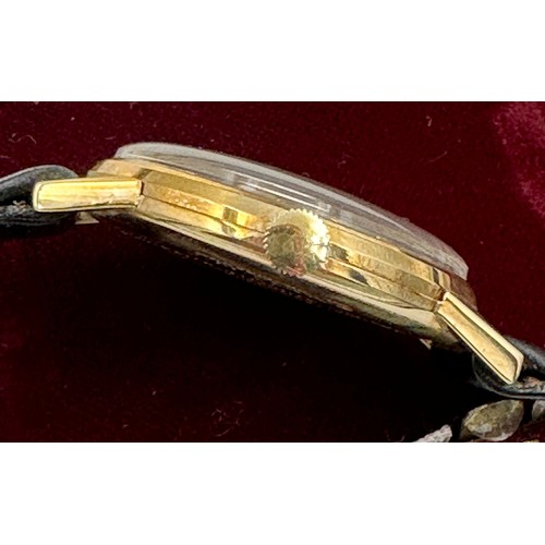 617 - A 9ct gold Rolex Tudor presentation watch on black leather Rolex strap. Presented to J.M. Platje by ... 