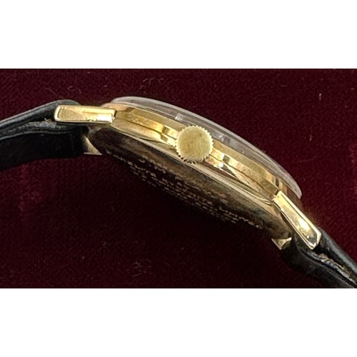 617 - A 9ct gold Rolex Tudor presentation watch on black leather Rolex strap. Presented to J.M. Platje by ... 