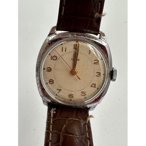 619 - A 1950's gentleman's Tudor cushion wristwatch on brown leather strap and Rolex buckle. Dennison case... 