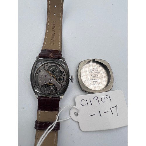 619 - A 1950's gentleman's Tudor cushion wristwatch on brown leather strap and Rolex buckle. Dennison case... 