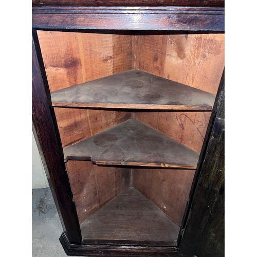 53 - An early 19thC/ late 18thC single door oak corner cupboard with 'H' hinges 81h x 57w x 34cm d.