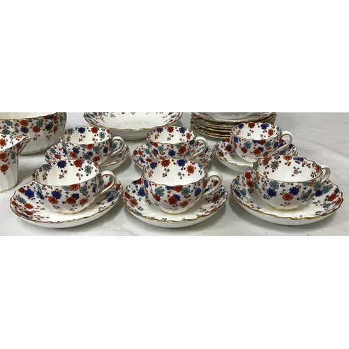 233 - A Royal Crown Derby part tea service decorated in blue and red flowers to include 6x cups, 8x saucer... 